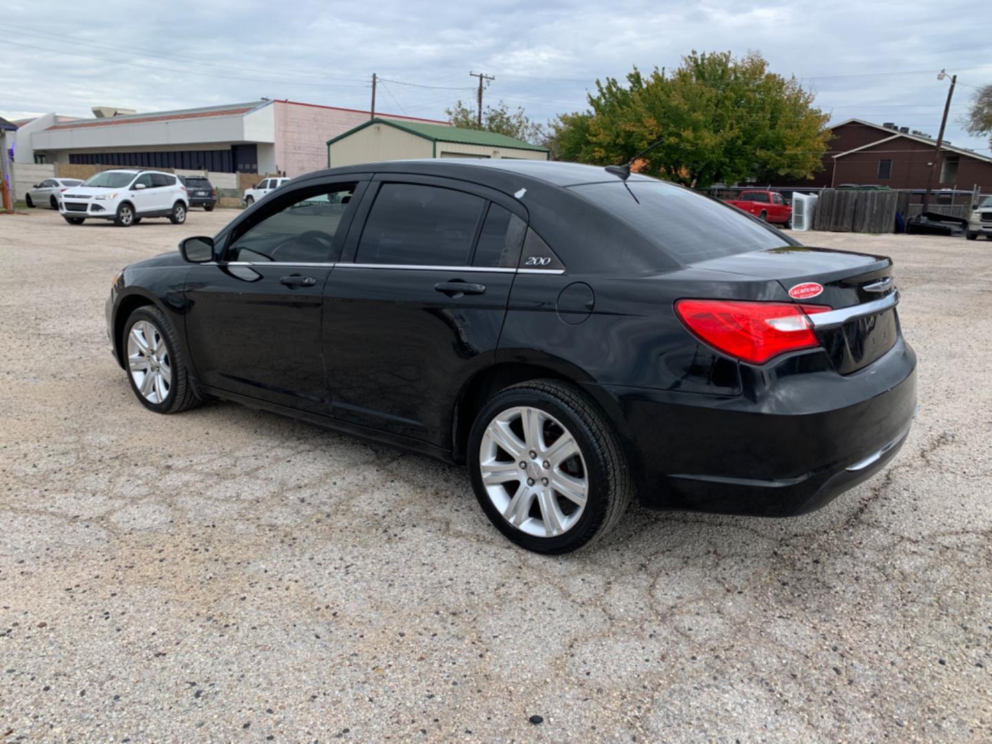 2012 Black /Black Chrysler 200 LX (1C3CCBAB3CN) with an 2.4L L4 DOHC 16V engine, Automatic transmission, located at 1830 North Belt Line Road, Irving, TX, 75061, (469) 524-0199, 32.834373, -96.993584 - Photo#5